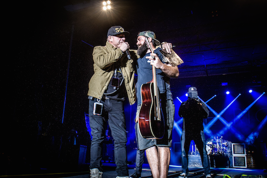 John Reese on stage with Driftwood Hometown Hero Justin Paul Carnegie